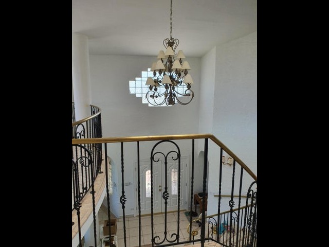 chandelier above stairs